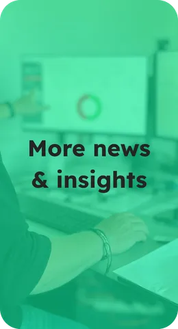 Image of data-analysis in an office setting with the caption: "More News & Insights"